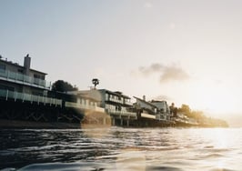 Seaside sunset beach harbor waterfront properties houses luxury resort coastal coast