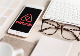 Airbnb logo on smartphone