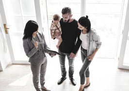Family meeting with real estate agent in show home