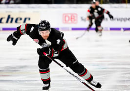 hockey player skating down the ice