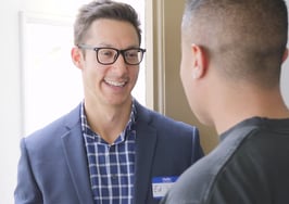 Ed Wu speaking to a man