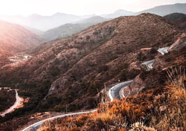 road winding through countryside and mountains