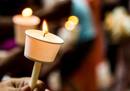 A candle lit vigil to represent real estate agent deaths.
