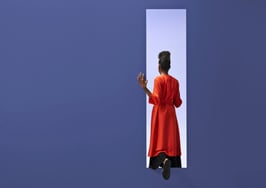 woman exiting purple room