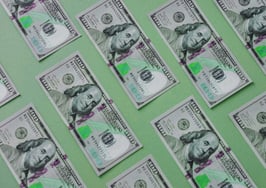 hundred dollar bills lined up