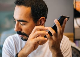 Man with visual disability using technology