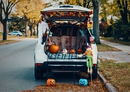 real estate trunk or treat — decorated cars and community families