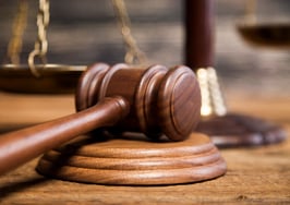 John Davis settles sex misconduct claims as contempt deadline looms