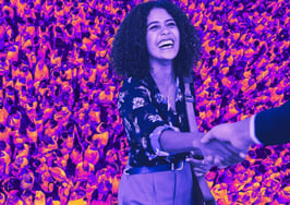 A picture of a woman shaking hands with someone, indicating that the deal is done and she's avoided these real estate lead generation mistakes.