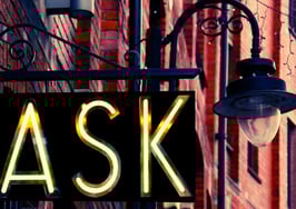 An image of an "ASK" sign outside of a building to symbolize 35 questions to ask your next broker.