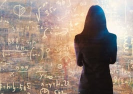 A woman staring at the data to represent the formula for closing two sales a week.