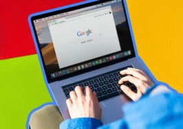 A picture of someon googling something to show how to set up your Google Business Profile in real estate.