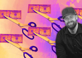 A picture of scissors cutting through a ten-dollar bill to symbolize cutting your real estate marketing spend.