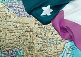 A map of China with the Texas flag draped over it