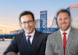 Gavin Swartzman and Corey Hasting in front of Jacksonville, Florida, skyline