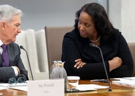 Federal Reserve Governor Lisa Cook speaks with Fed Chair Jerome Powell at a June 25, 2025 open meeting at the Federal Reserve Board building in Washington, D.C.
