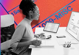 A woman working at a computer symbolizing how to set up a new real estate business.