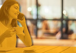 A real estate agent on the phone in her office following up after a client meeting to represent Why Most Real Estate Agents Lose The Deal.