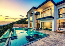 A picture of a pool outside of a mansion to represent the LA mansion tax failure.
