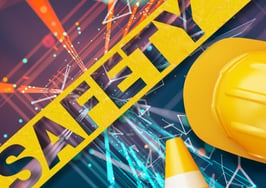 A picture of safety tape and a hard hat to show safety risks for real estate agents.