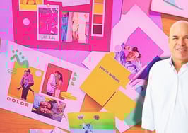 A picture of contributor Jimmy Burgess in front of a board of marketing to symbolize effective real estate marketing campaigns.