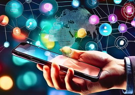 An image of a hand holding a phone with apps in the ether behind it to represent a viral real estate post.