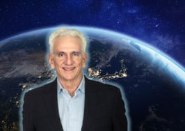 Stuart Siegel in front of a satellite image of Earth