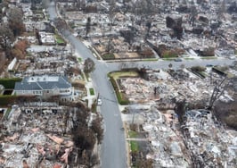 In an aerial view, neighborhoods lie in ruins after the Palisades Fire on January 30, 2025 in Pacific Palisades, California. (Photo by Qian Weizhong/VCG via Getty Images)