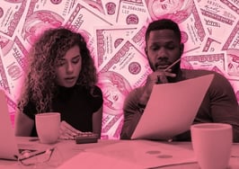 A picture of a man and a woman with their computers and spreadsheets all over the table to the backdrop of money to illustrate brokerage budget planning.