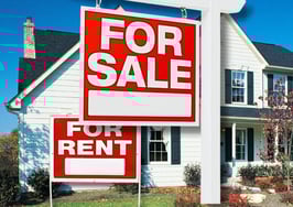 An image of a for sale and for rent signs in front of a house to signify how to list a property with tenants.