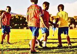children playing soccer