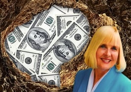 An image of a hole with money in it to represent real estate profit holes and real estate business profitability.