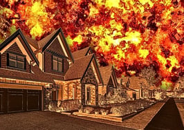 An image of homes with an explosion behind them to illustrate the real estate portal wars.