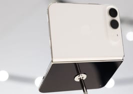 iPhone Duo unfolded in star white, showing the larger screen real estate agents could use for listing photos and multitasking