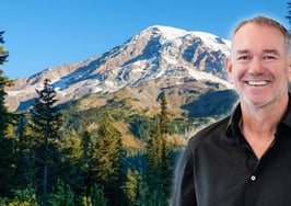 An image of OB Jacobi in front of a Washington mountain to symbolize the Compass-NWMLS settlement.