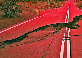 An image of a crack in the road to represent real estate market shifts.