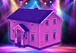 An image of a home under the spotlights on a stage to represent the social media marketing mistakes made when focusing on yourself.