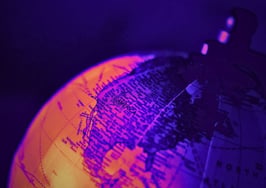 Globe illustration representing real estate brokerages expanding into new markets around the world.