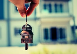 Picture of a house with keys in the foreground representing a buyers market 2026