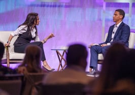 CMLS CEO Jessica Edgerton and Compass CEO Robert Reffkin on stage at the CMLS Open House conference in Fort Lauderdale, Florida, before Edgerton announced the CMLS legal action fund.