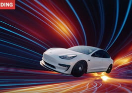 A white Tesla representing the subject of Tesla Roadster memes on X