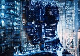 An image of a blurry face behind a bunch of tech design to represent ai amplification risks.