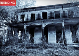 Older two-story house, illustrating scary Zillow listings featured in Halloween content