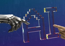 Robot hand and human hand reaching toward the letters AI