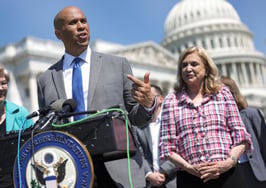 U.S. Sen Cory Booker (D-NJ) (C), joined by Sen. Elizabeth Warren (D-MA) (L) and Rep. Carolyn Maloney (D-NY) speaks at a press conference in Washington, DC. The Warren, Booker real estate letter to the FTC urges probe on commission-sharing, private listings