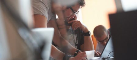 A group of young people working in a startup environment