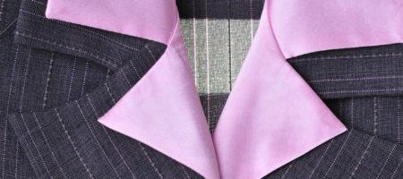 A pink collar in a women's suit