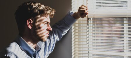 Neighbor staring through blinds