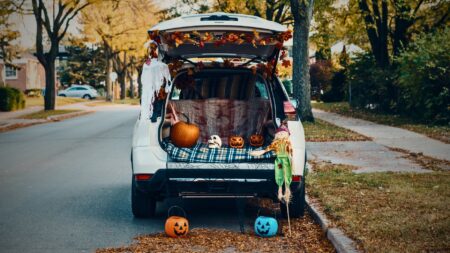 real estate trunk or treat — decorated cars and community families