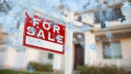 A listing with a for-sale sign and snow flakes falling to represent a listing that has gone cold or that isn't selling.